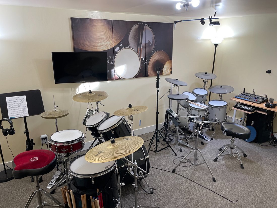 Ogden Drum Studio teaching room with acoustic and electronic drum kits